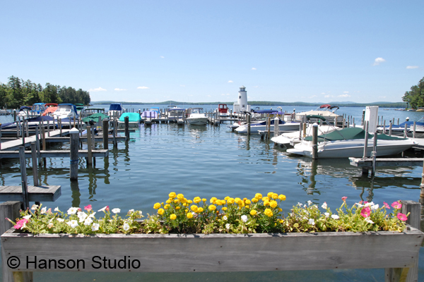 Lake Winnipesaukee - Lighthouse and flowers near Long Island Bridge